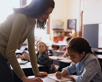 teacher helping student